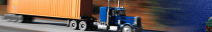 Image of a truck, cargo ship and train